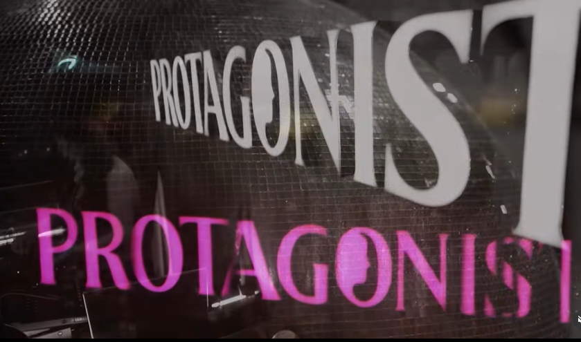Picture of Protagonist logo over glitterball